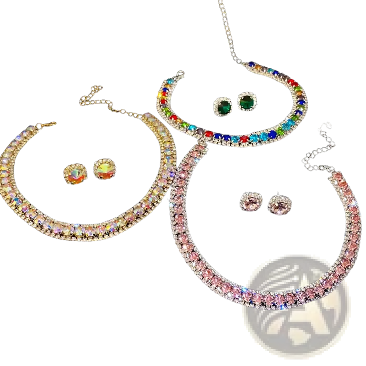 Crystal necklace and earring set featuring sparkling pink ab, rainbow, and multicolored designs on black velvet tray