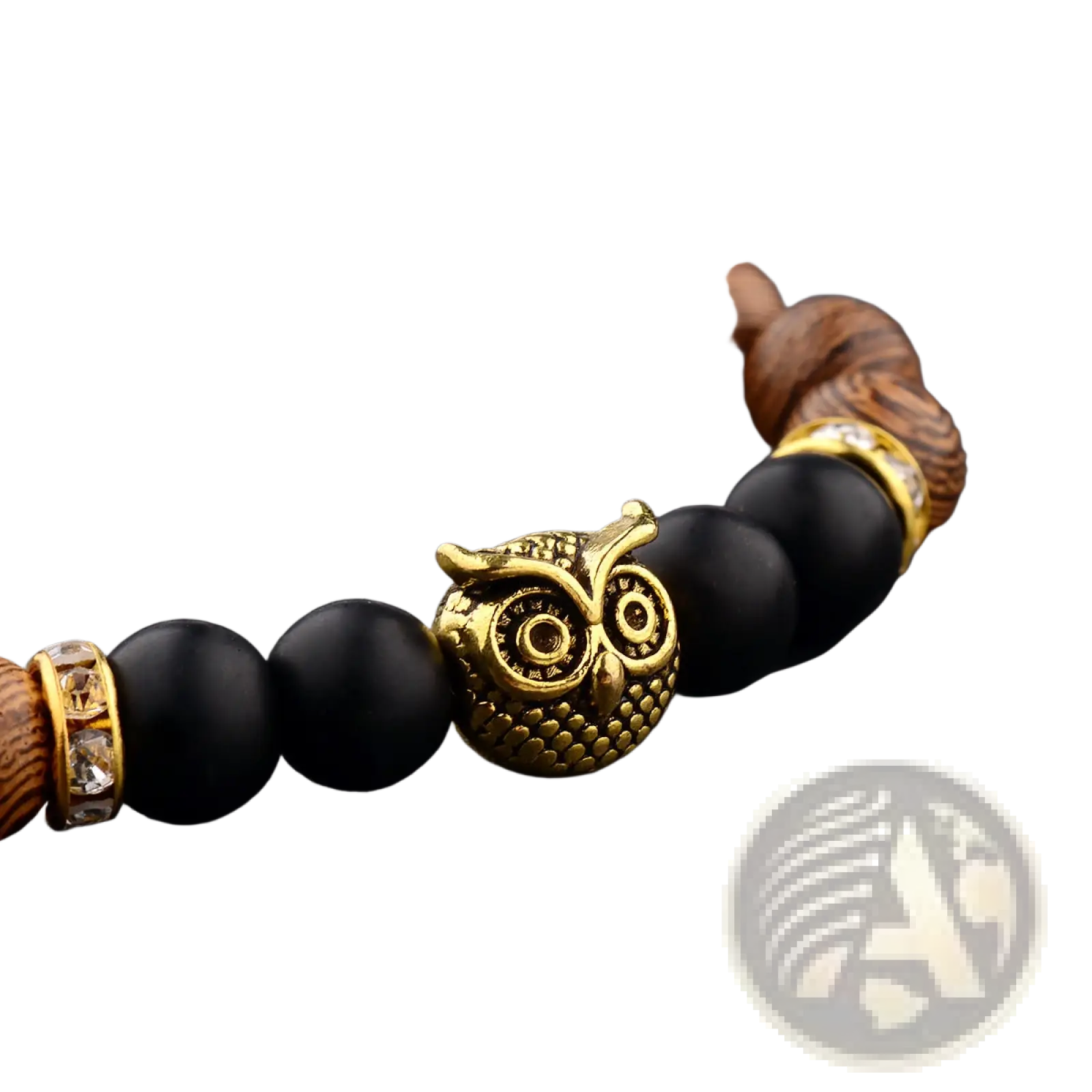 A gold-toned owl charm adorns a crystal encrusted wood and onyx beaded bracelet with dark brown and black beads