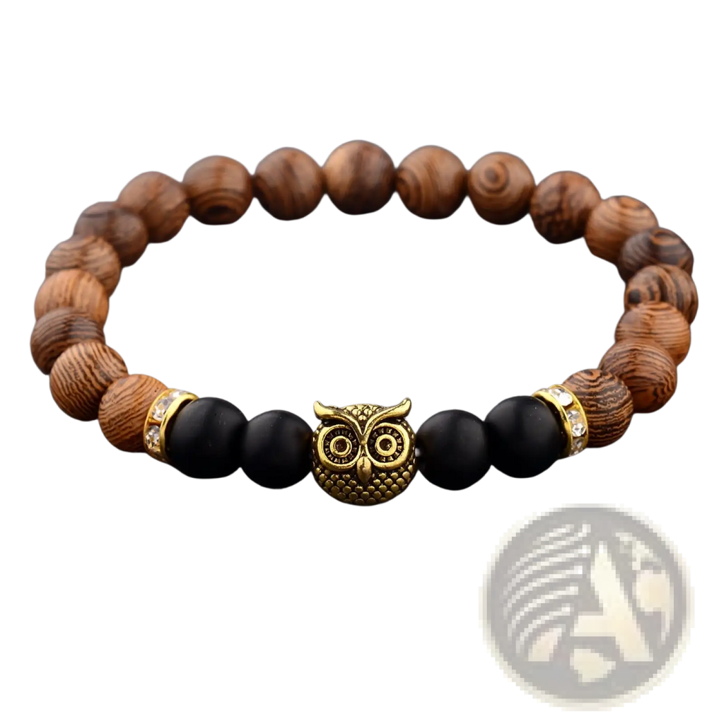 A gold-toned owl charm bracelet with alternating brown wood and black onyx beads accented by crystal spacers