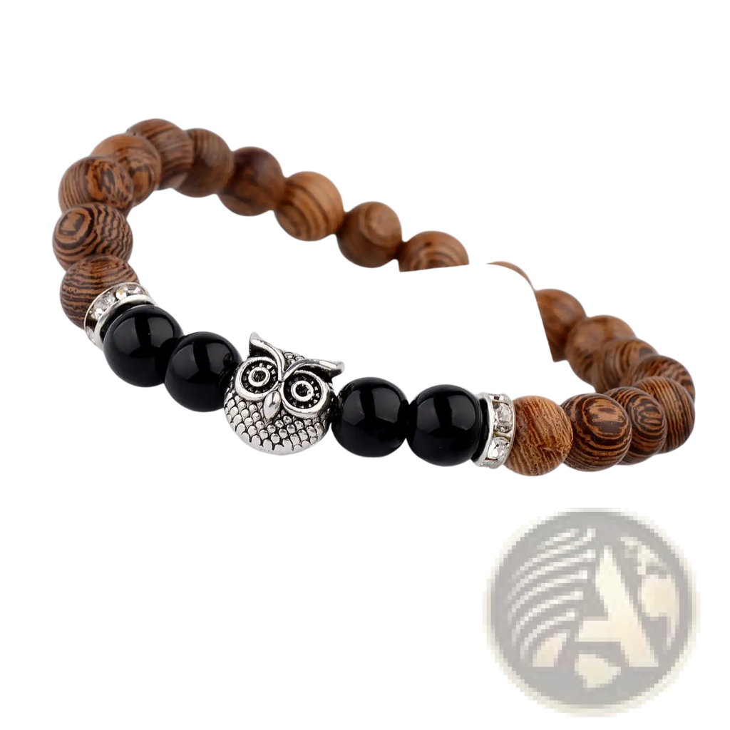A wooden and black bead bracelet with a silver owl charm from the crystal owl charm wood and onyx beaded bracelet collection