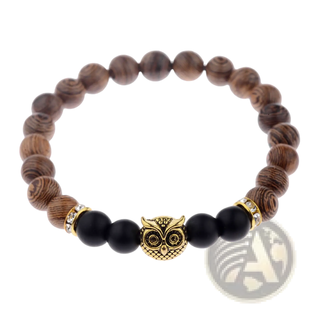 A brown wood and onyx beaded bracelet with a central gold owl charm and crystal-encrusted metal accents