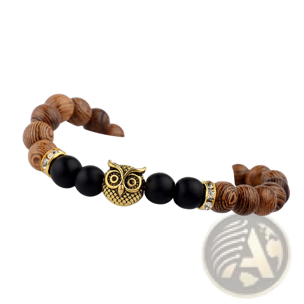 A stylish wooden and black bead bracelet featuring a gold owl charm and crystal bead accents in the center
