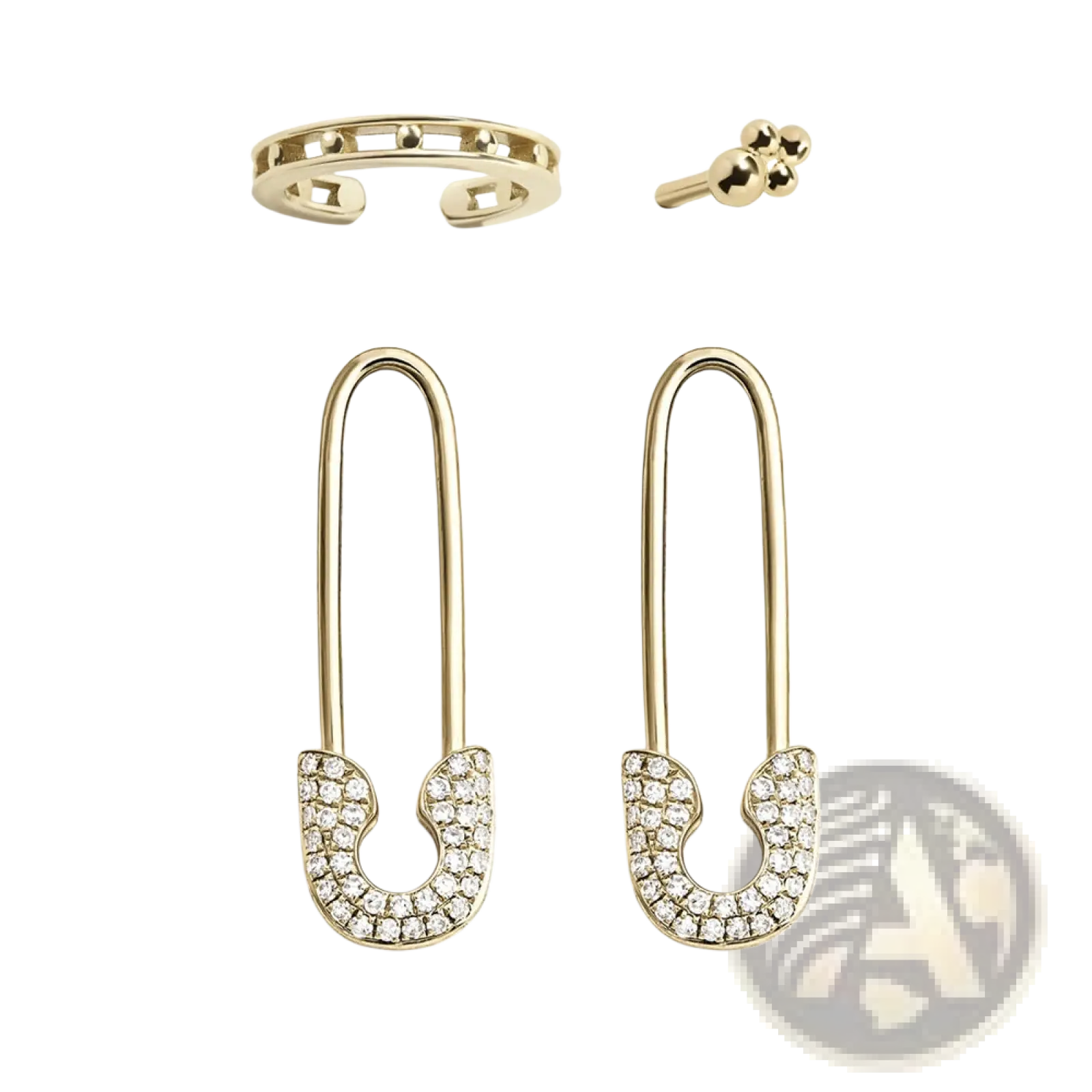Gold safety pin earrings adorned with clear crystal pave along the curved lower section in a studded accessory set