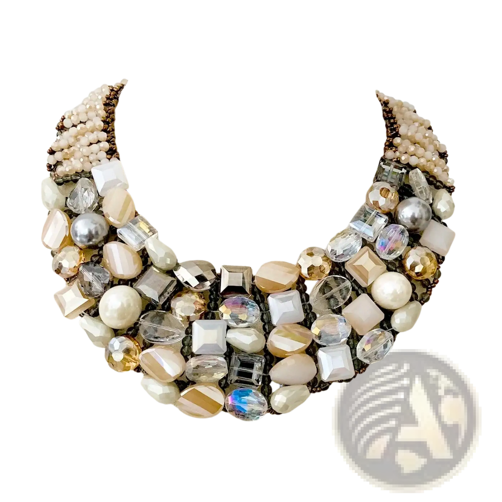 A crystal pearl statement choker necklace with layered faceted crystals pearls and metallic beads in cream gold and silver