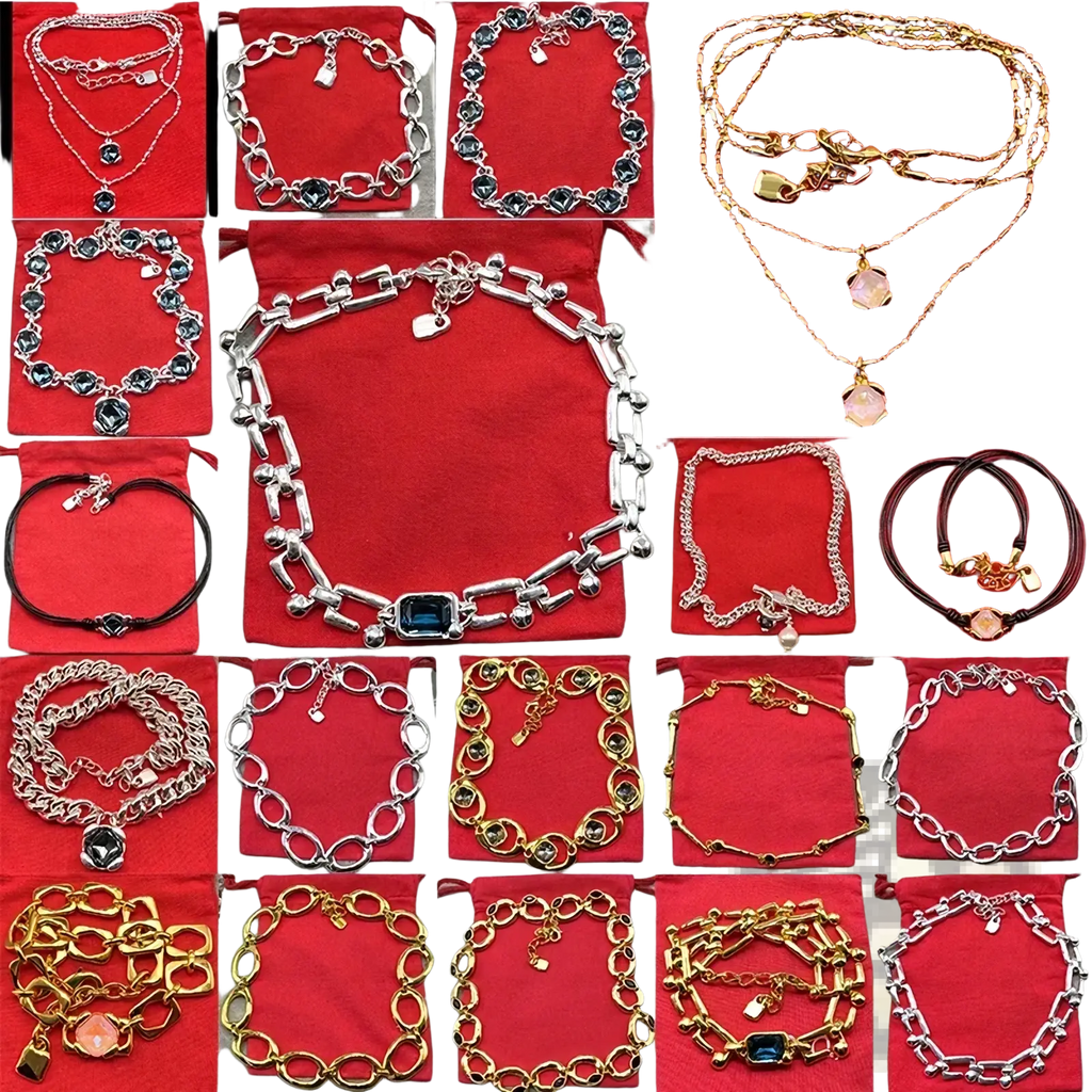 A collection of crystal pendant jewelry set gold and silver tone necklaces and bracelets with gemstone charms on red velvet