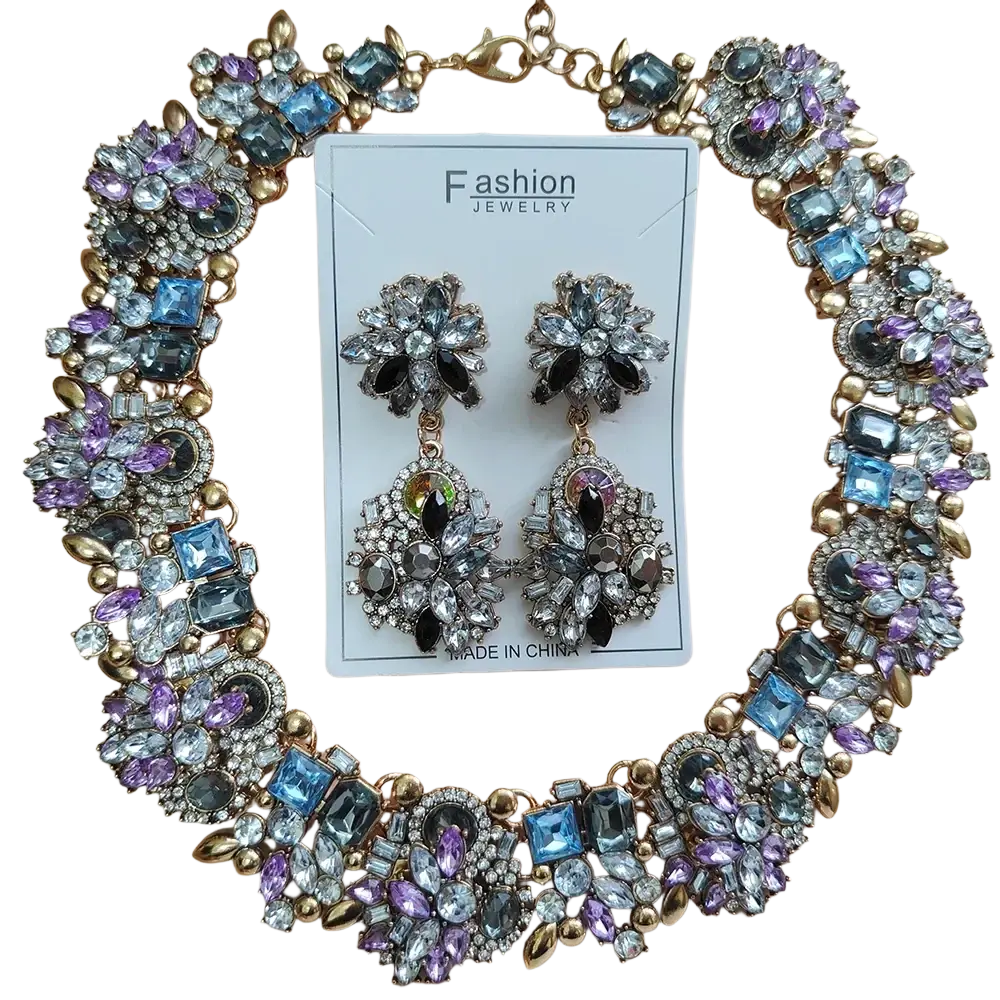 Crystal rhinestone statement necklace set featuring a gold-toned floral design with blue purple rhinestones and clear crystals
