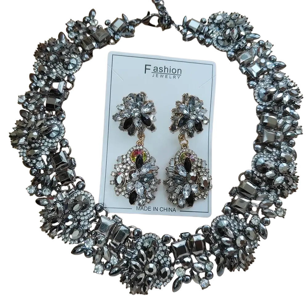 A glamorous black and silver crystal rhinestone statement necklace set with floral design choker and matching earrings