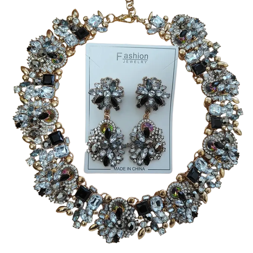 Gold-toned crystal rhinestone statement necklace set with clear and black faceted crystals accented by round pearls