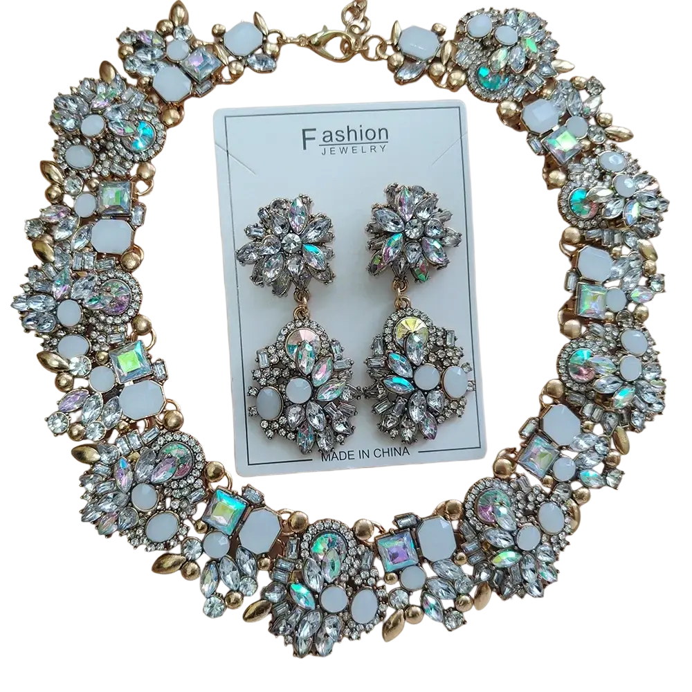 Gold-toned crystal rhinestone statement necklace set with sparkling clear and iridescent crystals and white enamel floral stones