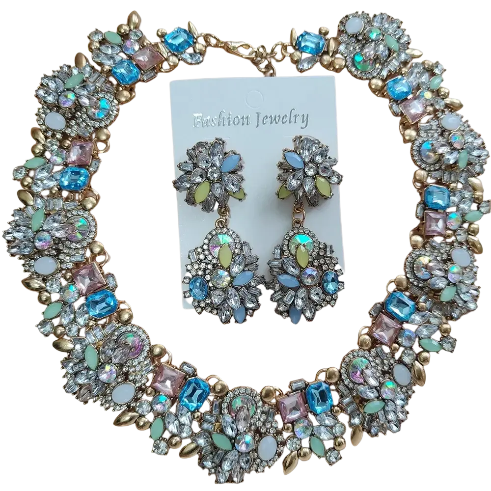 A sparkling gold-toned crystal rhinestone statement necklace set with blue pink green and clear floral rhinestones