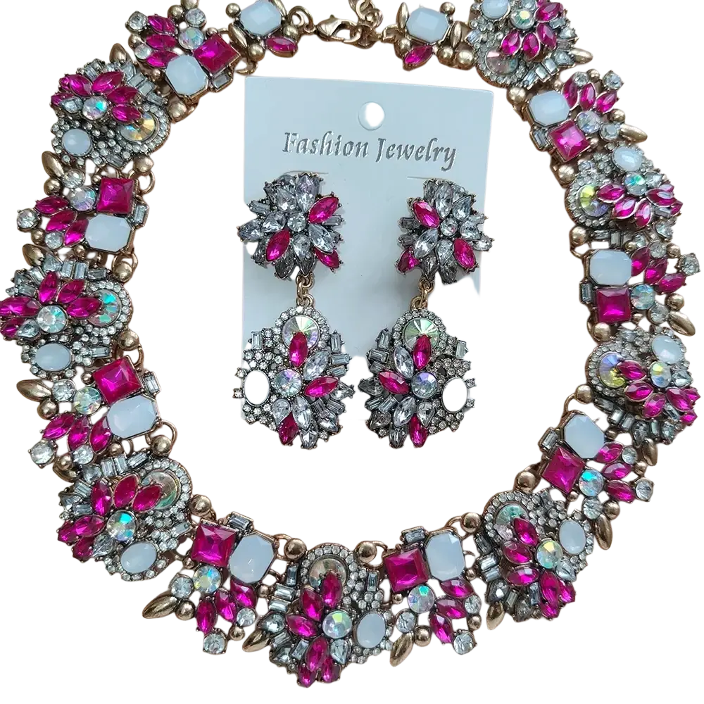 A vibrant pink and silver crystal rhinestone statement necklace set with sparkling rhinestones and white opal-like stones