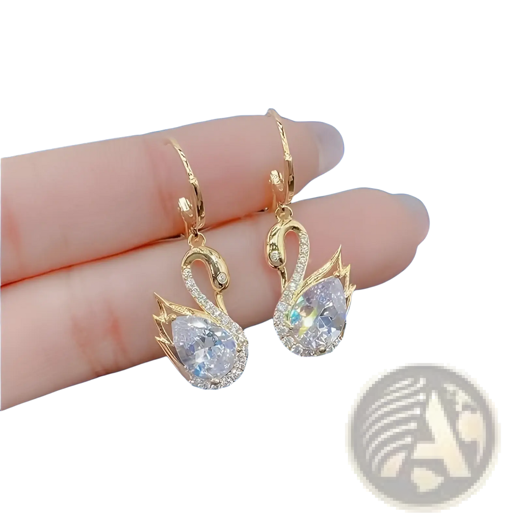 Gold-toned crystal rhinestone swan drop earrings for women with sparkling clear crystals and a pearlescent stone center