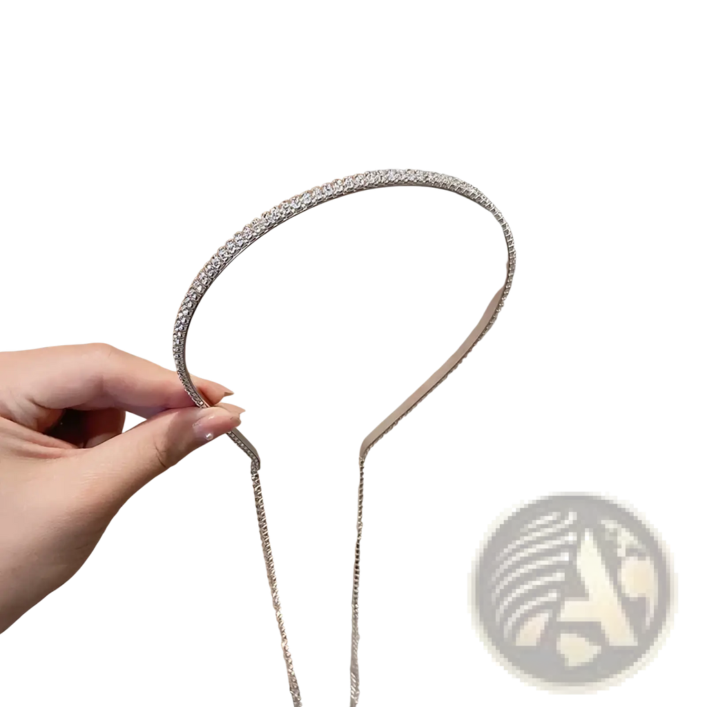 A sleek silver crystal rhinestone tassel headband for women with delicate chain extension and sparkling details