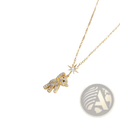 Gold-toned titanium steel necklace with a sparkling bear pendant adorned with clear crystals and a matching star charm