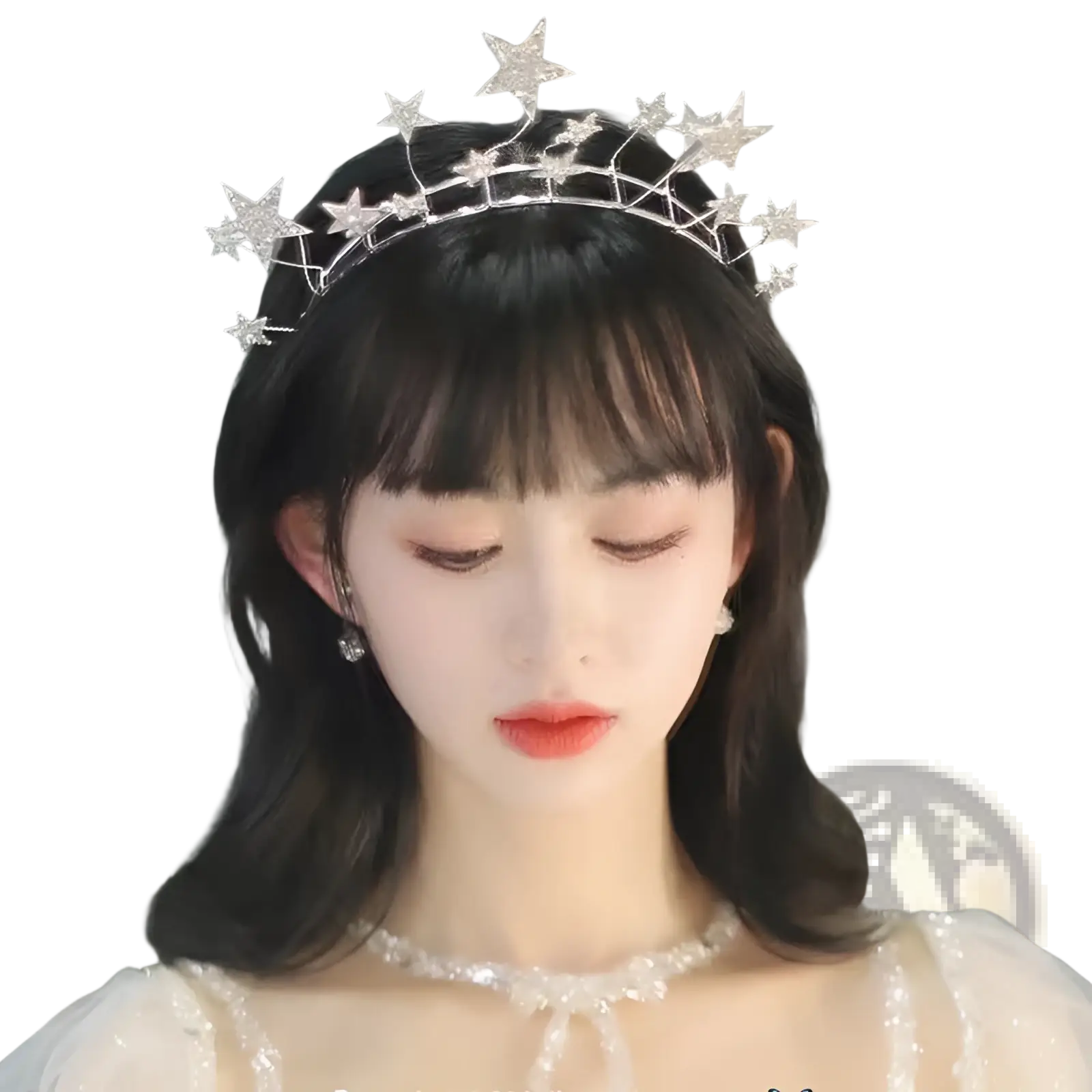 A delicate silver crystal star bridal tiara with sparkling rhinestones and intricate wirework wedding crown