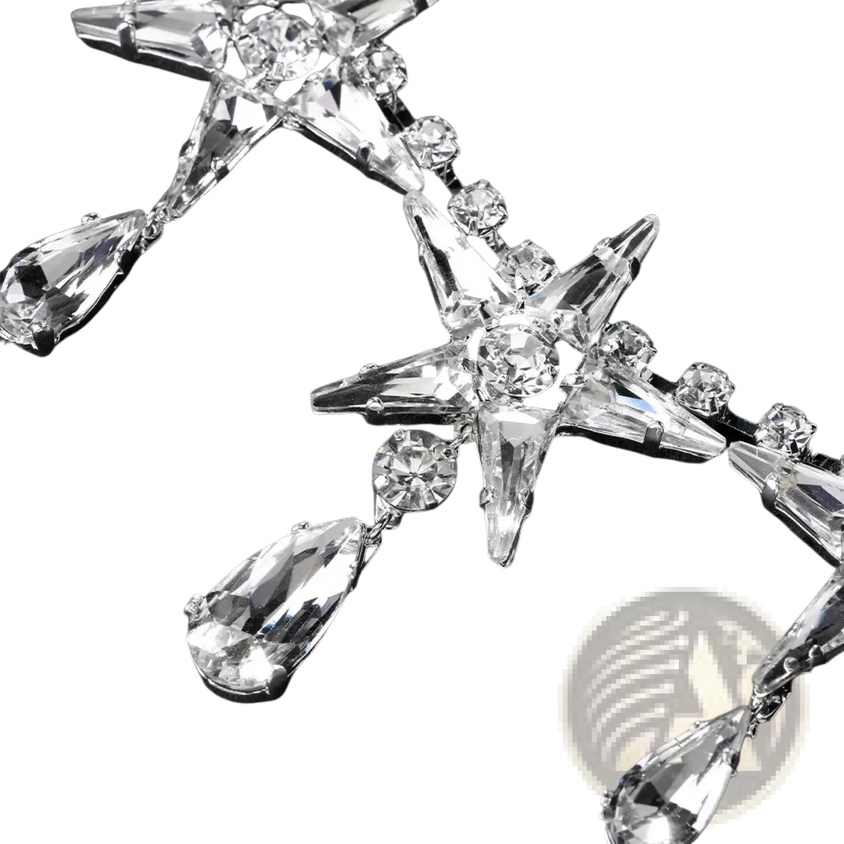 A crystal star choker necklace featuring a sparkling star-shaped earring with clear faceted crystals and teardrop pendants