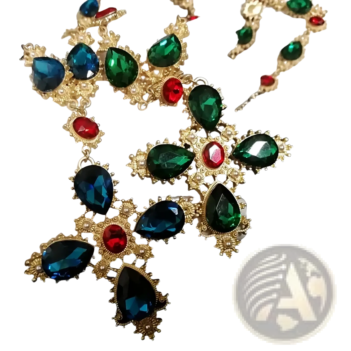 A dazzling gold-toned crystal statement choker necklace with emerald green blue and ruby red teardrop crystals