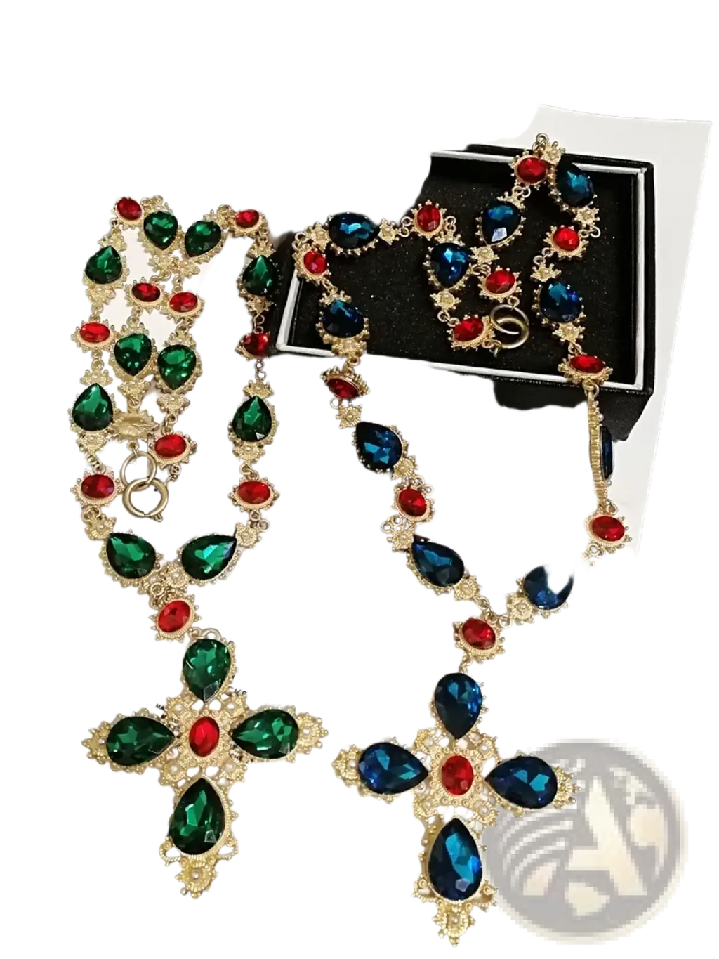 A gold-toned crystal statement choker necklace and earrings set with green, blue, and red teardrop crystals in cross design