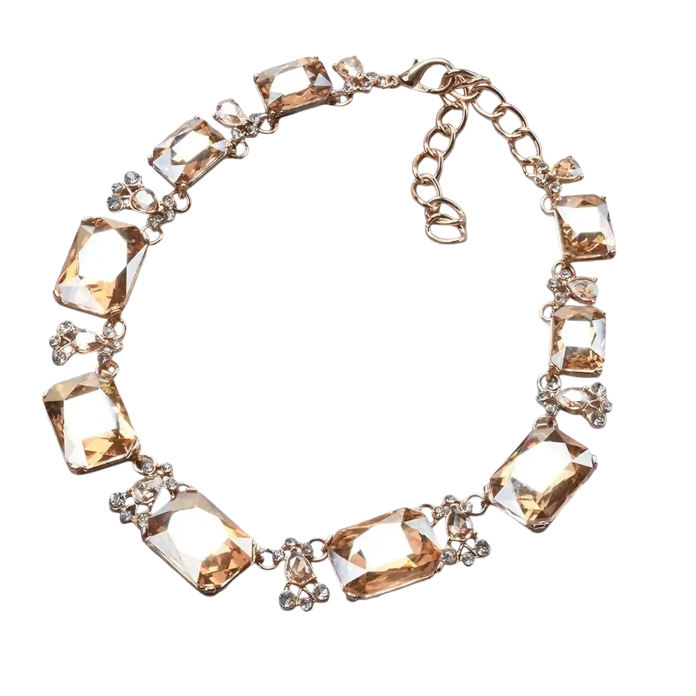 A gold-toned crystal statement necklace with amber faceted crystals and clear rhinestones in a bohemian choker design