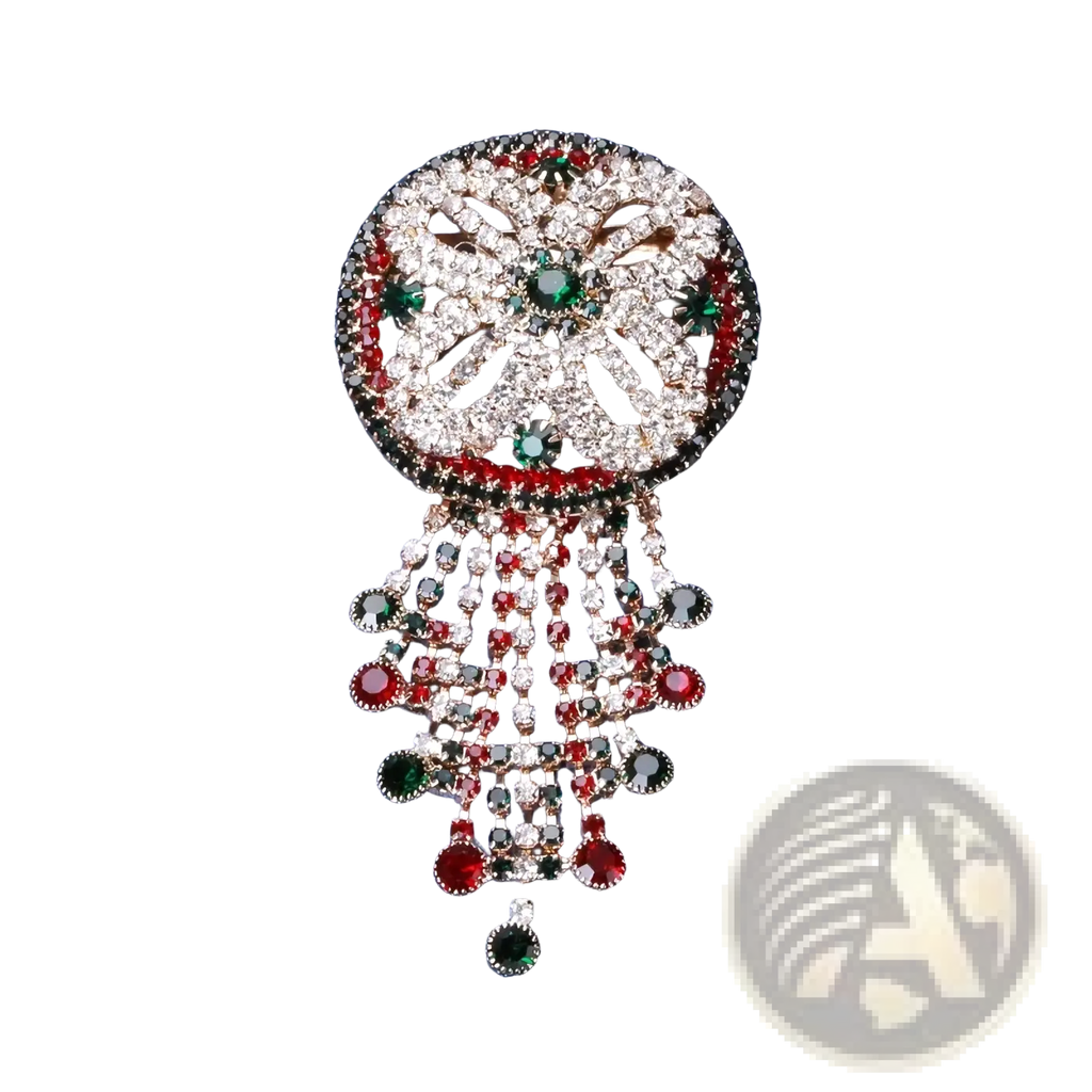 A sparkling crystal tassel brooch featuring clear red and green rhinestones in a floral pattern with dangling strands