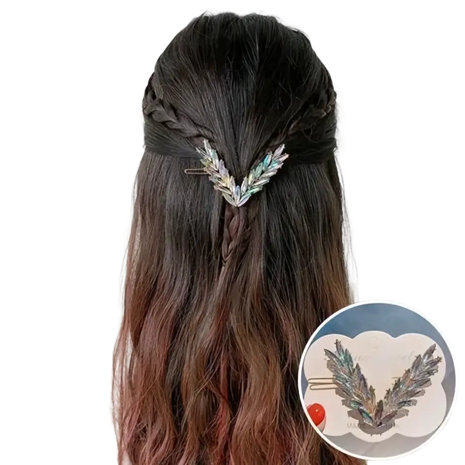 Crystal v shape hair clip set featuring a metallic feather-shaped clip with iridescent green and silver accents