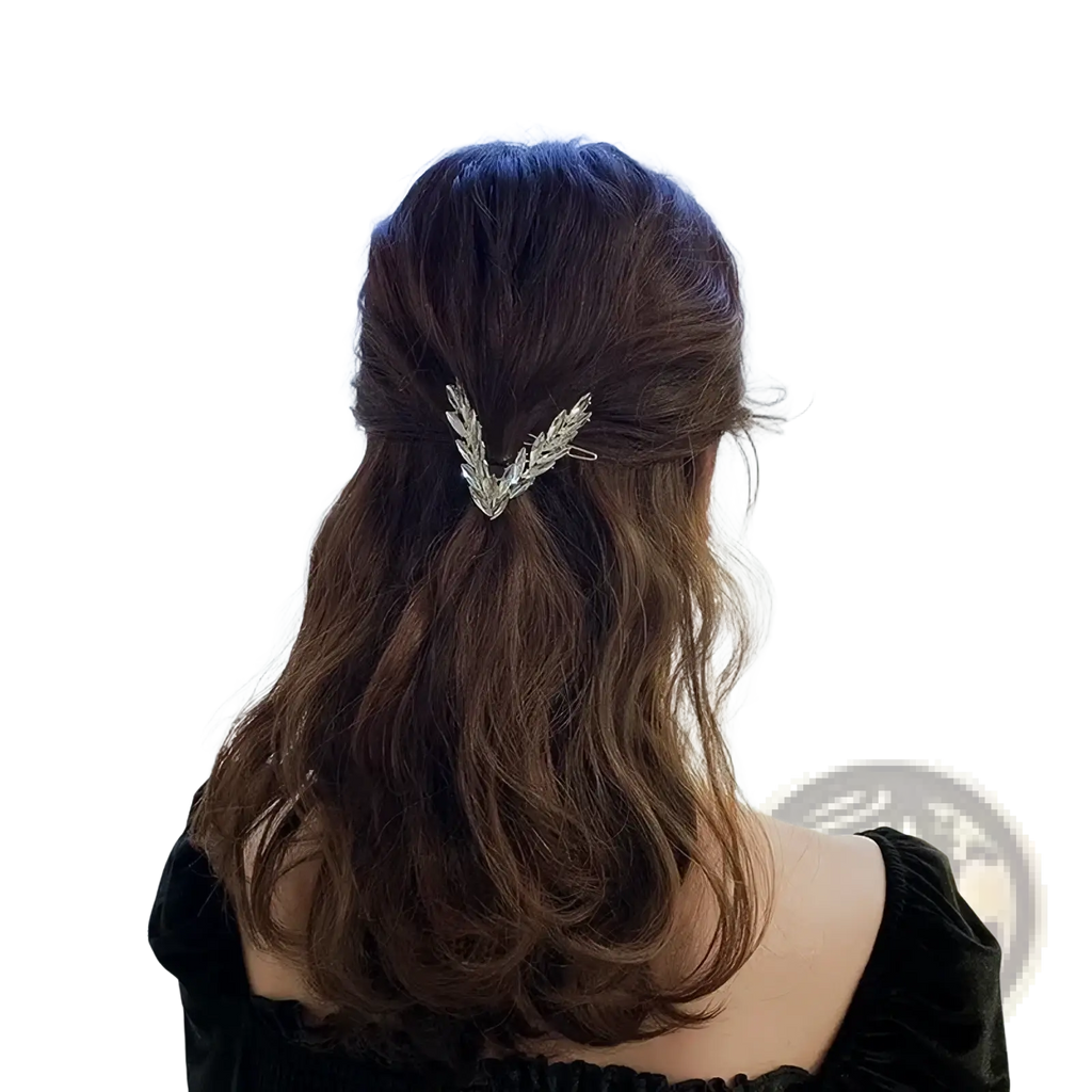 Silver leaf-shaped crystal v shape hair clip holding back dark brown wavy hair for stylish hair accessory use