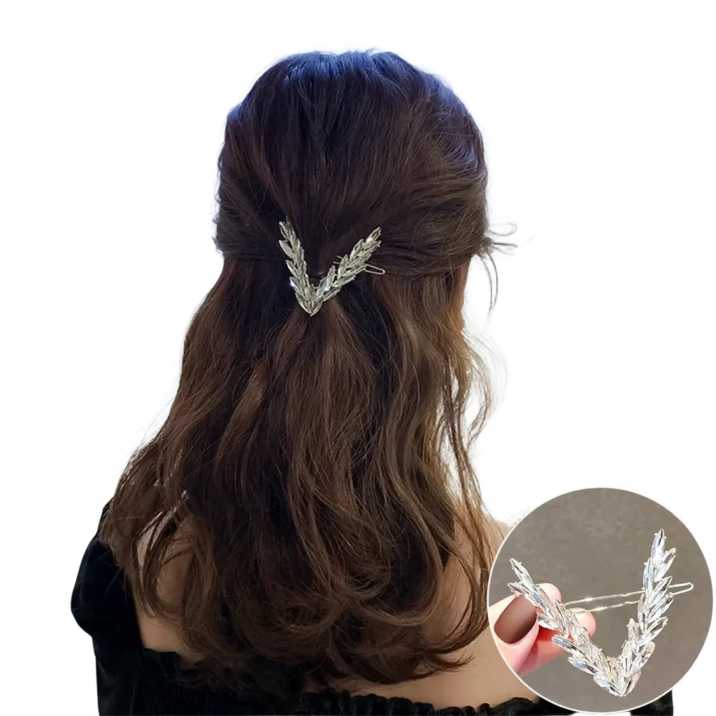 Silver metallic v-shaped hair clip with intricate leaf detailing from the crystal v shape hair clip set