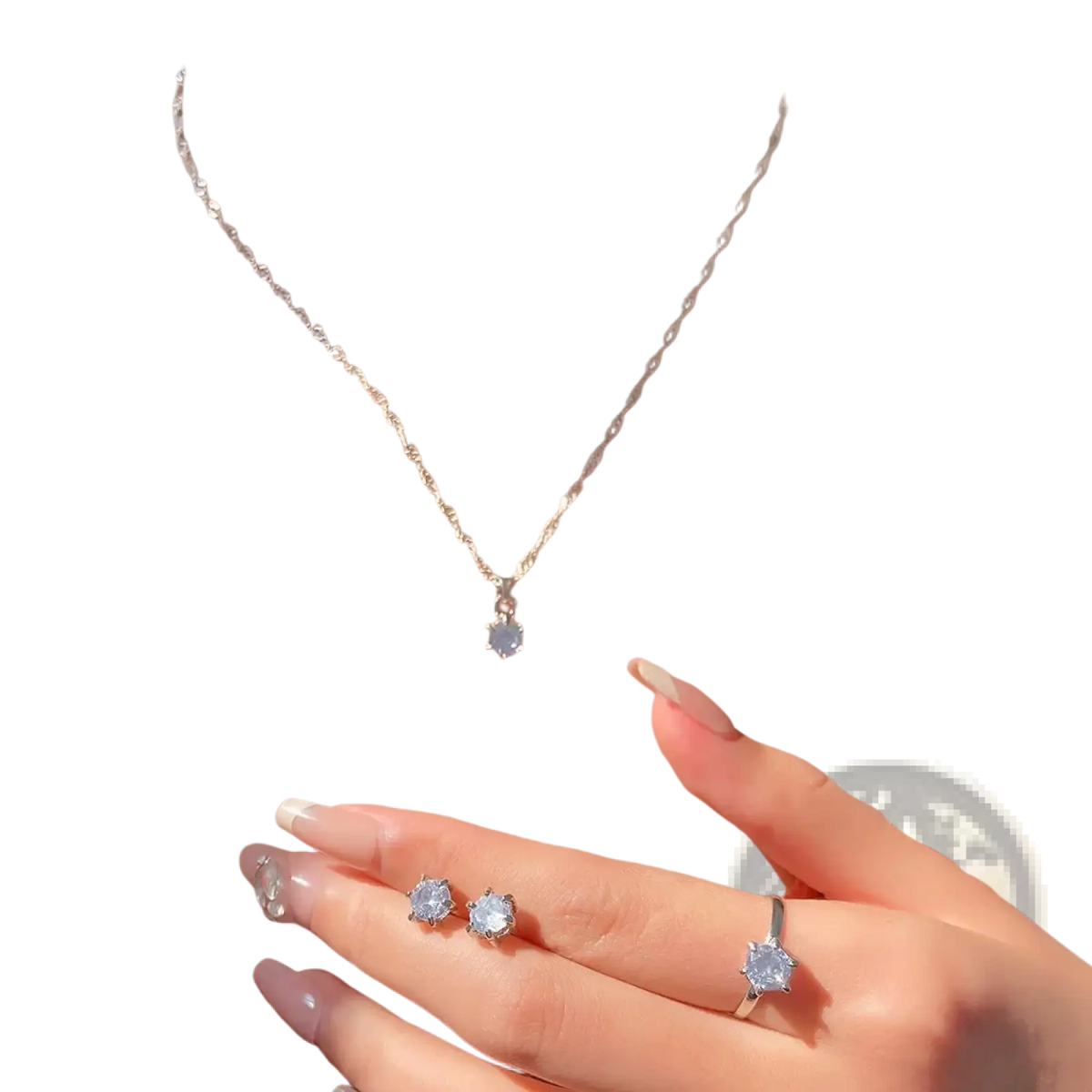 A delicate silver chain necklace with a small clear crystal zirconia pendant from a 5piece jewelry set