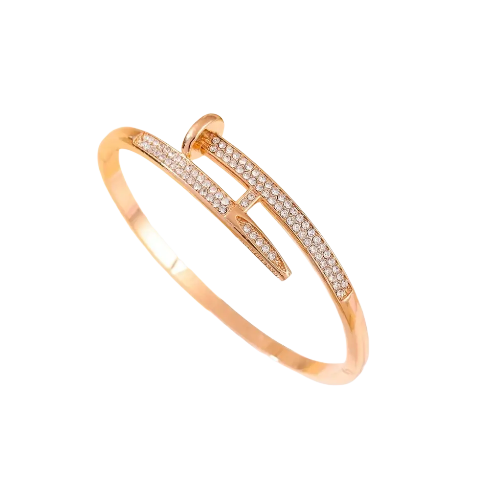 Gold-toned cubic zirconia intersecting bangle bracelet with sleek modern design and sparkling clear crystals