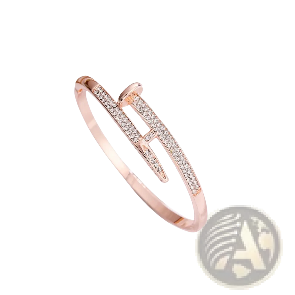Rose gold cubic zirconia intersecting bangle bracelet featuring a nail-shaped design with clear crystal accents