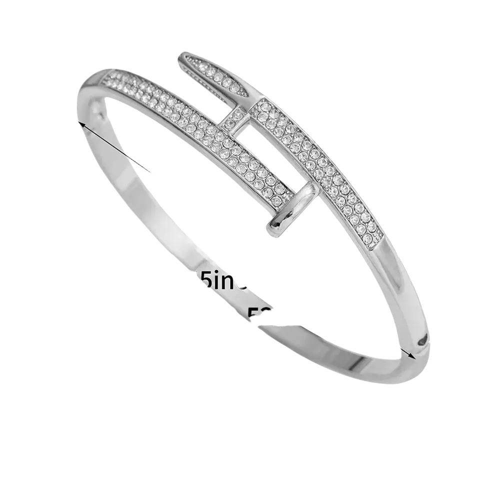 Silver-toned cubic zirconia intersecting bangle bracelet with bold geometric design and rows of clear stones