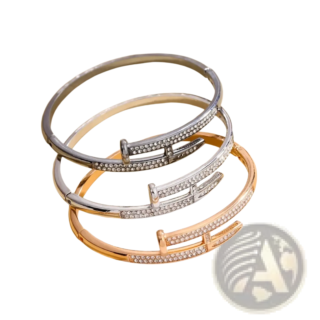 Three elegant cubic zirconia intersecting bangle bracelets in silver and rose gold with clear crystals along the band