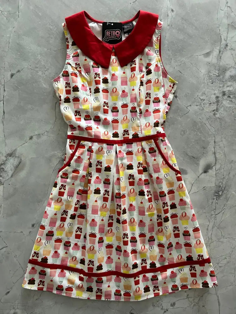 Retro cupcake print sleeveless cotton dress with red peter pan collar and colorful cupcake pattern with pockets