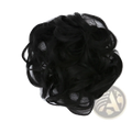 Curly synthetic hair bun extension in black with soft voluminous texture and natural-looking curls