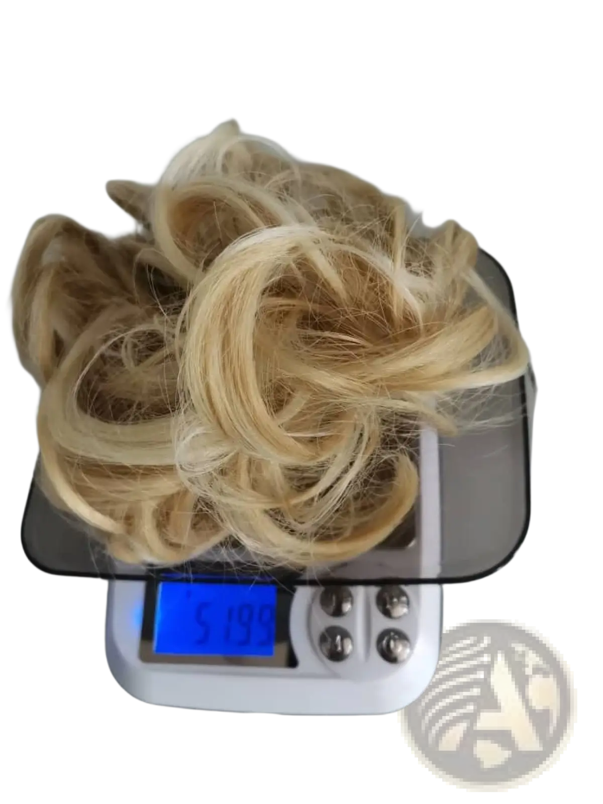 A blonde curly synthetic hair bun extension on a digital scale from the Curly Synthetic Hair Bun Extension 46 Colors collection