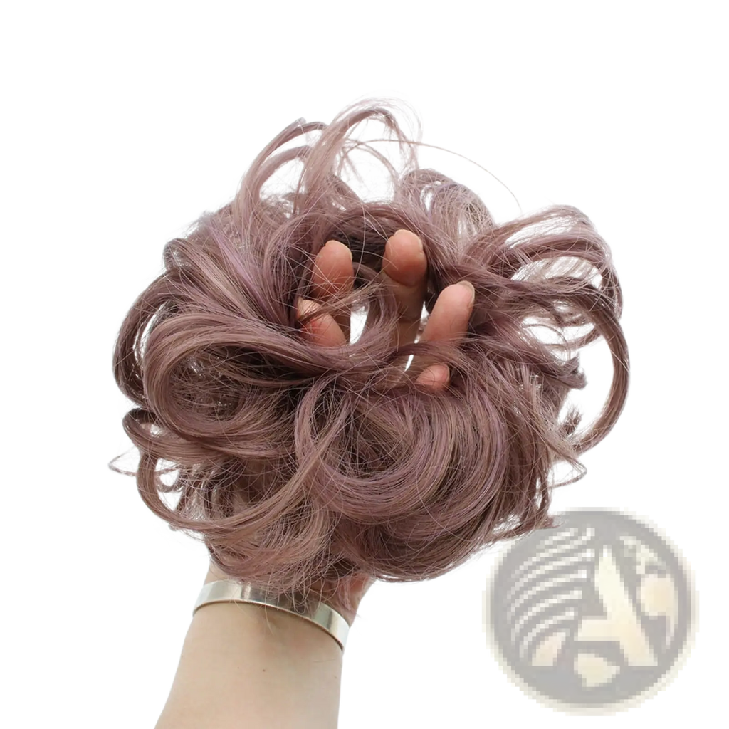 Curly synthetic hair bun extension in dusty rose with voluminous wavy texture made of soft synthetic fibers