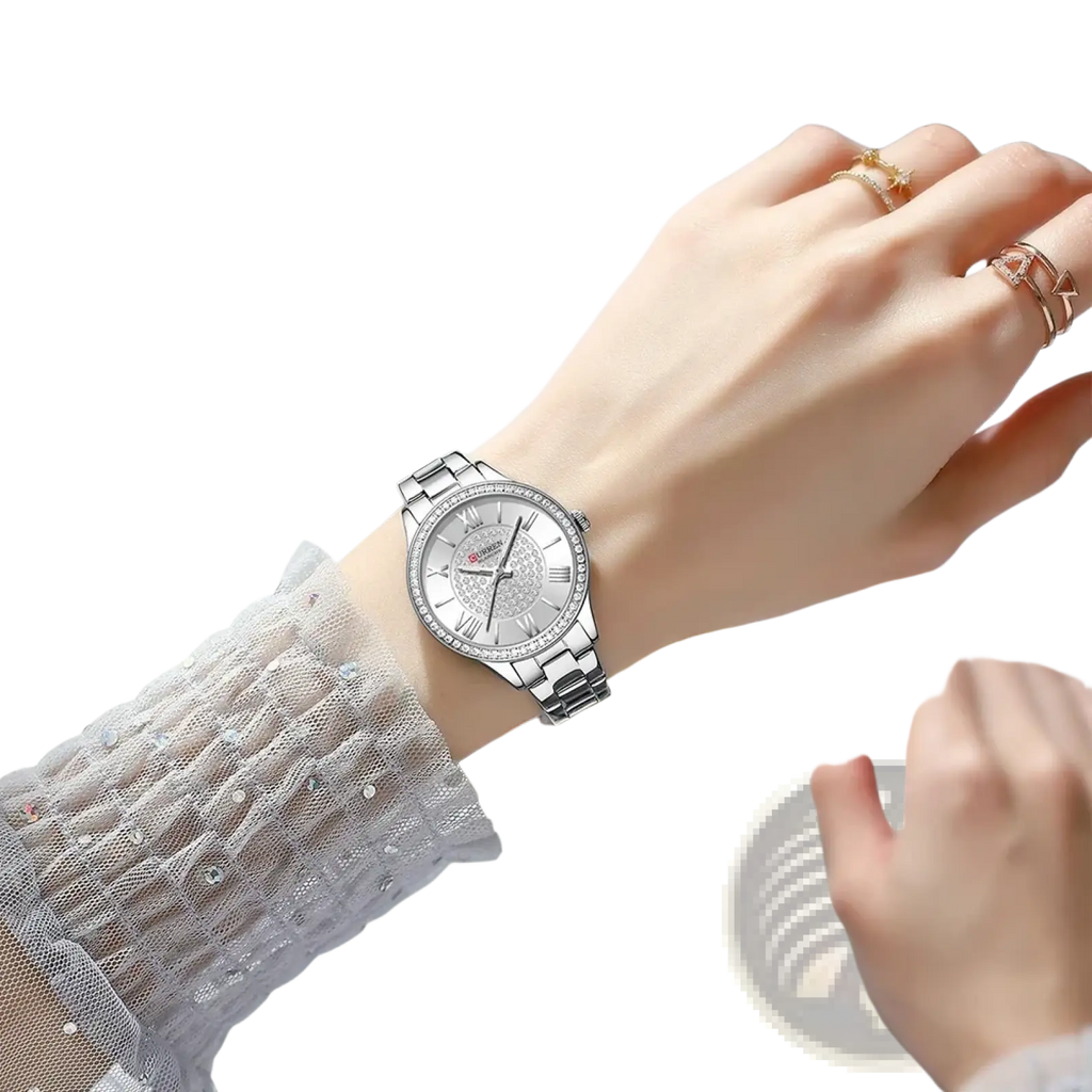 Curren rose gold women quartz watch with silver-toned stainless steel band and diamond-studded bezel with roman dial