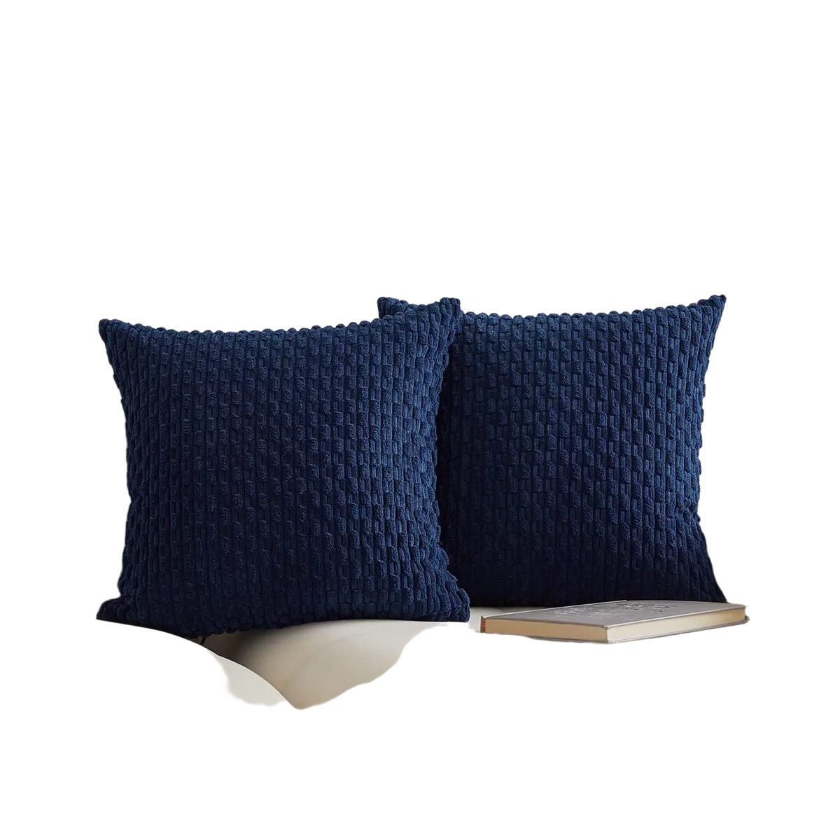 Two navy blue textured throw pillows with woven knit pattern on cream cushion cover for home decor