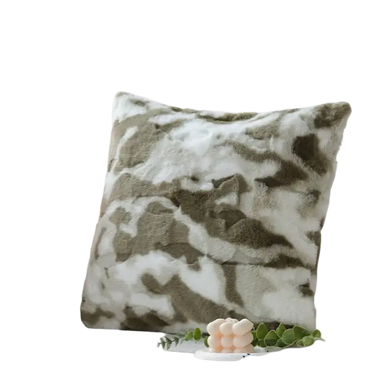 A plush faux fur cushion cover 45x45cm with soft olive and white camouflage pattern for living room use on a sofa