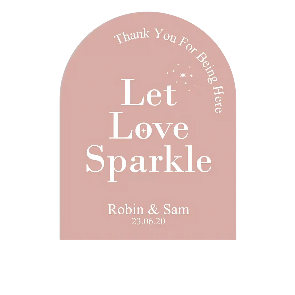 A soft pink arched wedding sticker with white let love sparkle text and personalized names and date for guests