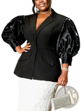 Custom black satin blazer featuring glossy puffy sleeves and a structured fit for a polished look
