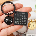 Black stainless steel custom calendar keychain featuring october 2026 square calendar and emma and kelly engraved charm