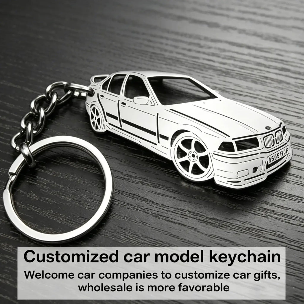 Silver metallic custom car model keychain shaped like a BMW e36 sedan with black detailing and chrome chain