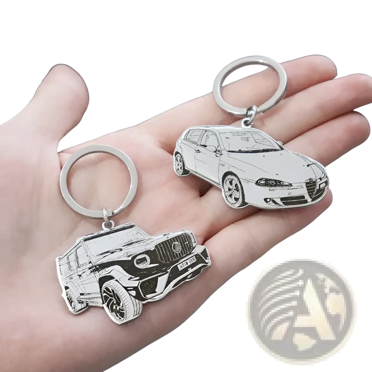 Two silver stainless steel custom car photo keychains featuring detailed line-art of luxury car models