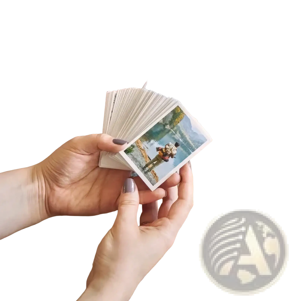 A hand holding a fanned stack of colorful custom couple photo print instant photos personalized as anniversary gift