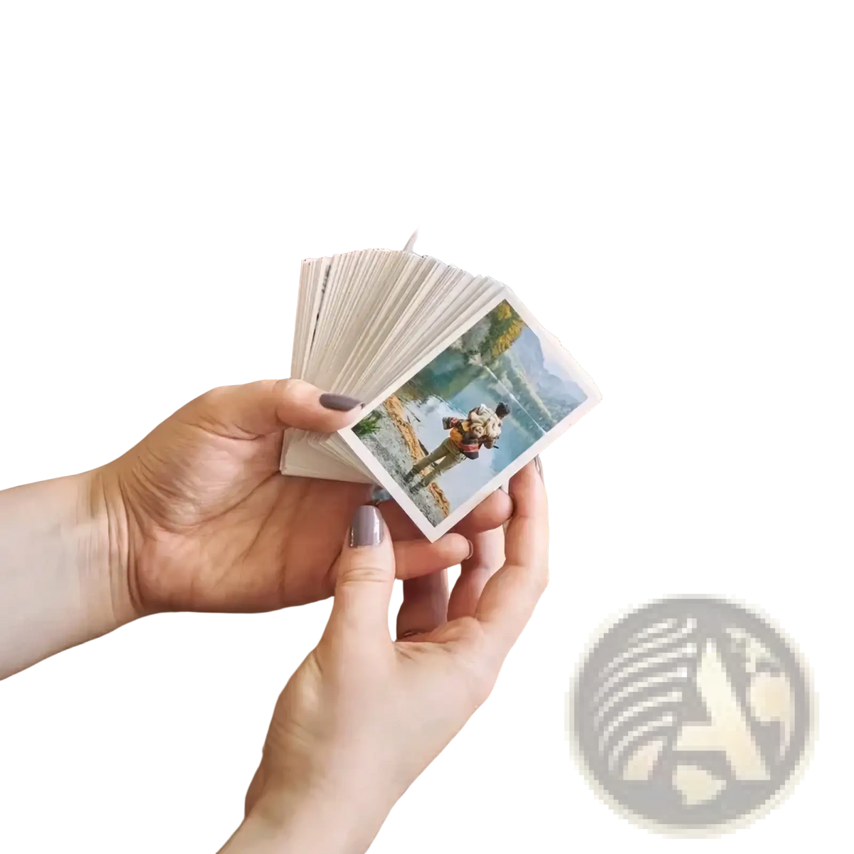 A hand holding a fanned stack of colorful custom couple photo print instant photos personalized as anniversary gift