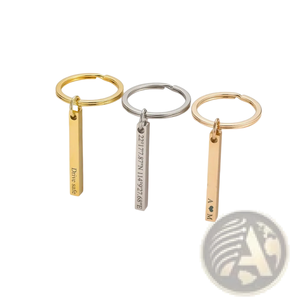 Three stainless steel custom engraved 4d bar keychains with circular rings and rectangular pendants displaying unique engravings