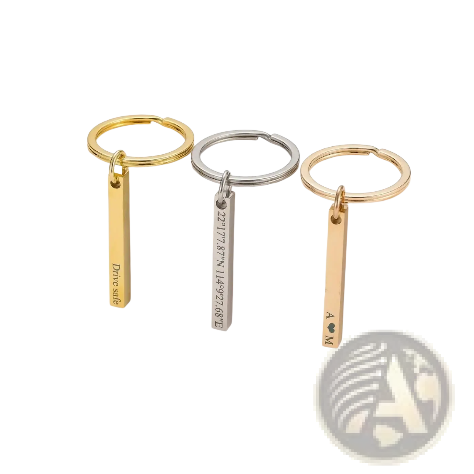 Three stainless steel custom engraved 4d bar keychains with circular rings and rectangular pendants displaying unique engravings