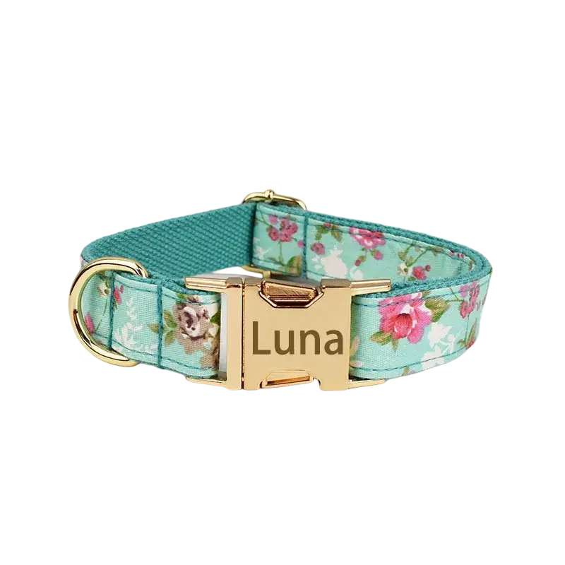 A mint green floral designer personalized dog collar with a gold-tone engraved buckle for pet accessories