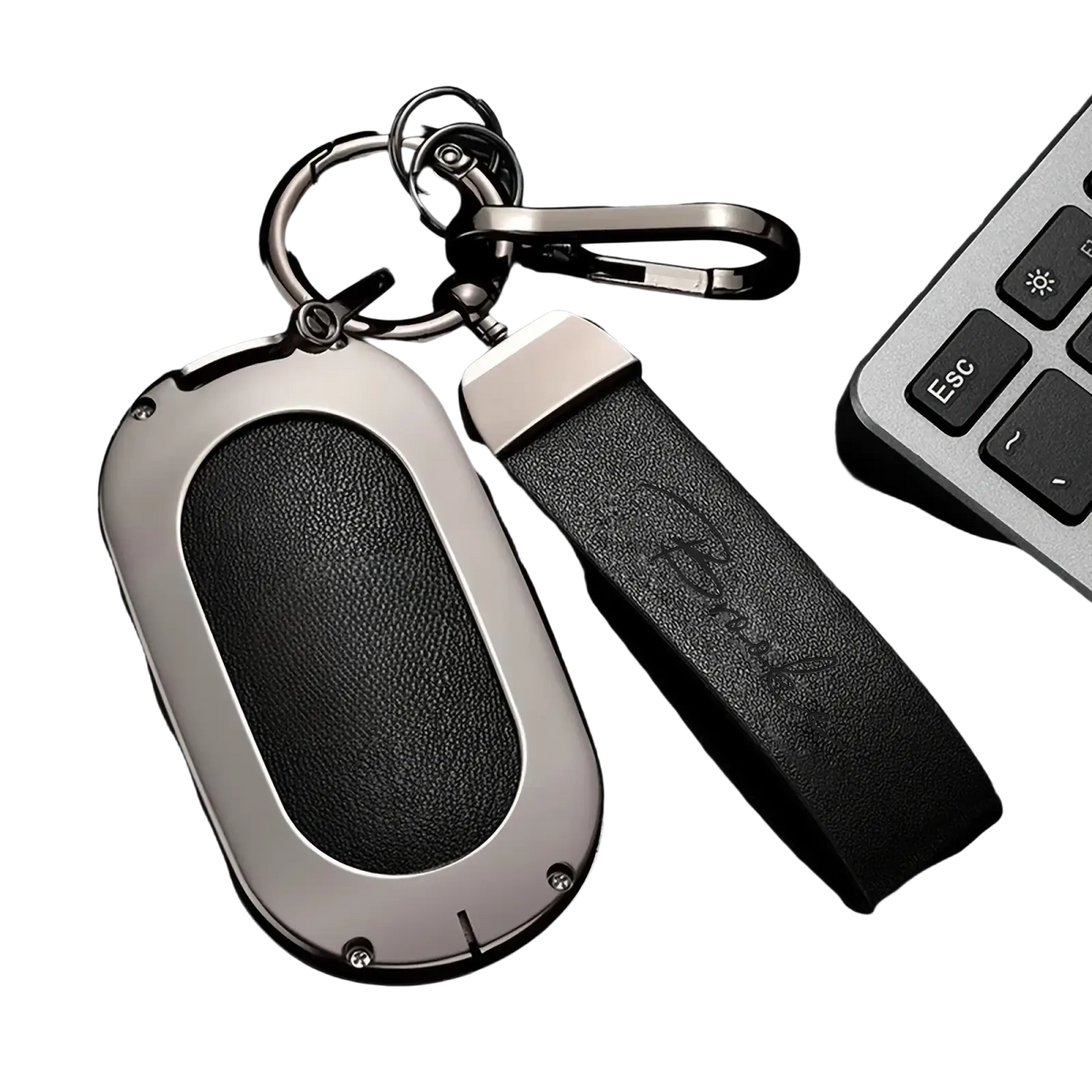 Black leather key fob with sleek silver frame and embossed strap personalized as a custom engraved leather keychain gift